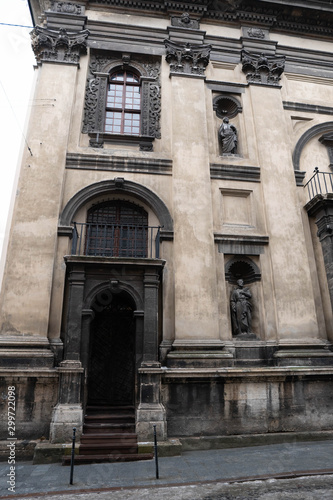 Closeup of Dominican Church in Lviv. Old building with staircase. Entrance Stairs The Door Old. Door to the Catholic Church. Stairs to the Church © Yaroslav Dzyun'