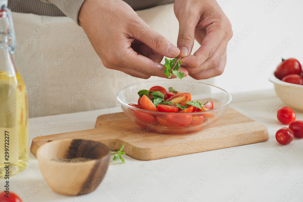 Fresh delicious salad with tomatoes. Doing fresh green salad Fresh delicious salad with tomatoes. Doing fresh green salad