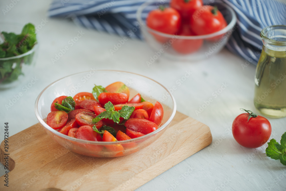 Fresh delicious salad with tomatoes. Doing fresh green salad Fresh delicious salad with tomatoes. Doing fresh green salad