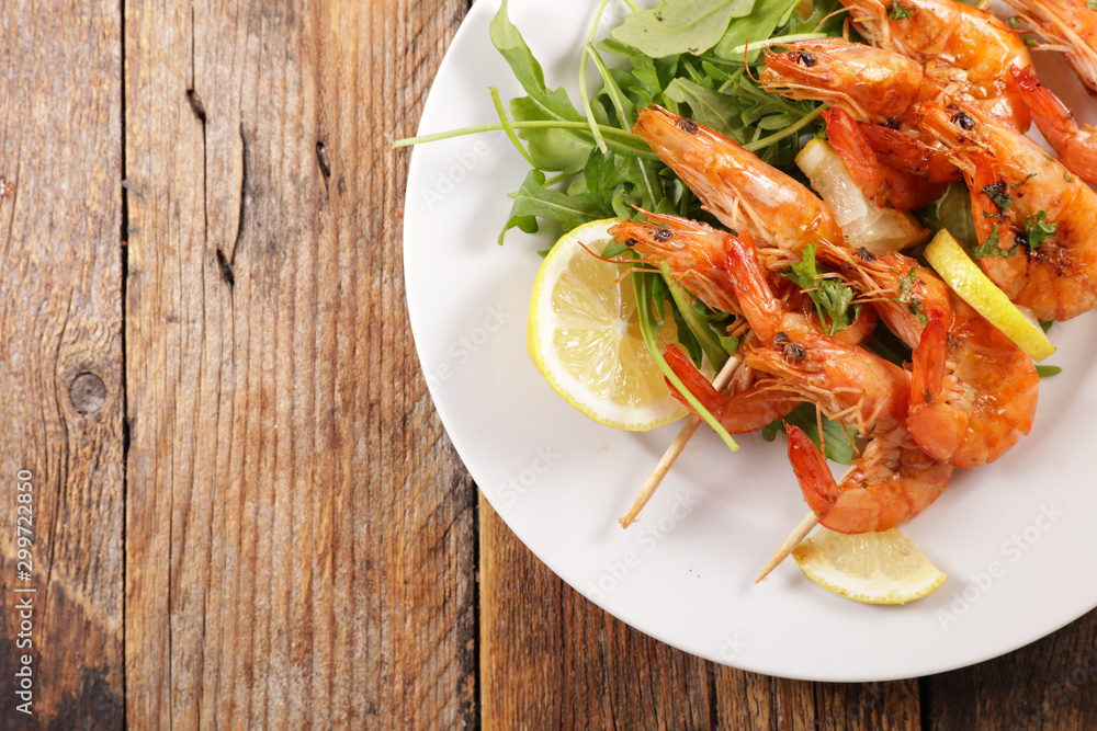 fried shrimp skewer on wood background