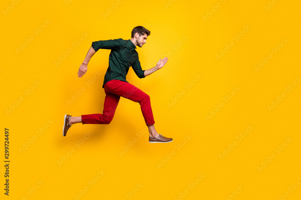 Full length body size profile side photo of serious confident man aspiring forward to win contests of running jumping isolated bright color background