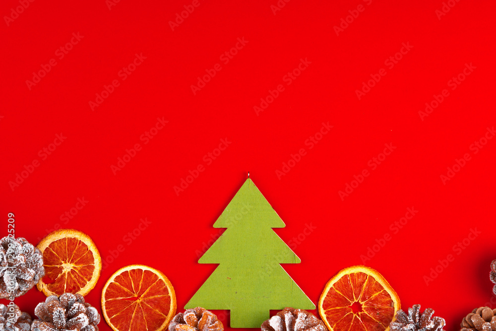 Christmas composition on red background with pine cones Christmas composition on red background with pine cones