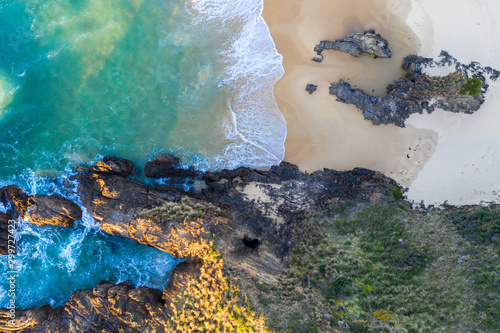 Beach, water tunnel and secret window high in the cliff photo