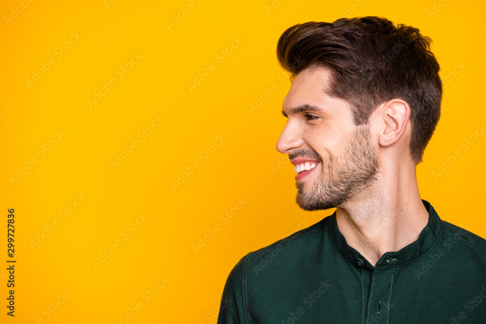 Fototapeta premium Profile side photo of smart positive charismatic guy look at copyspace enjoy summer holidays spend free time with his friends wear casual style clothing isolated over yellow color background