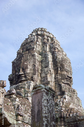 large faces carved on a tower of angkor thom temple