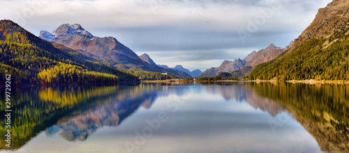 Mountain lake panorama with mountains reflection. Idyllic look. Autumn forest. Silvaplana Lake, Switzerland photo