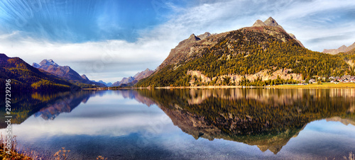 Mountain lake panorama with mountains reflection. Idyllic look. Autumn forest. Silvaplana Lake, Switzerland photo