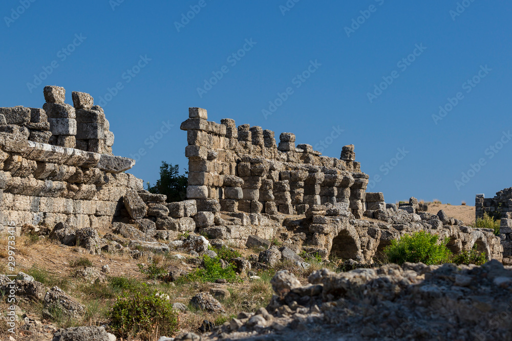 Ruins of the ancient city of Side and the Amphitheatre photo with the bird flight. 