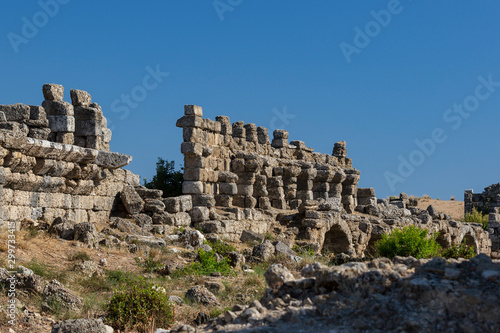 Ruins of the ancient city of Side and the Amphitheatre photo with the bird flight.  © lester120
