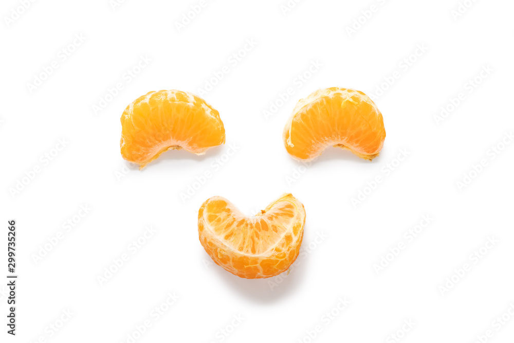 Three segments of Amorette mandarin orange arranged to be a smiley face Three segments of Amorette mandarin orange arranged to be a smiley face