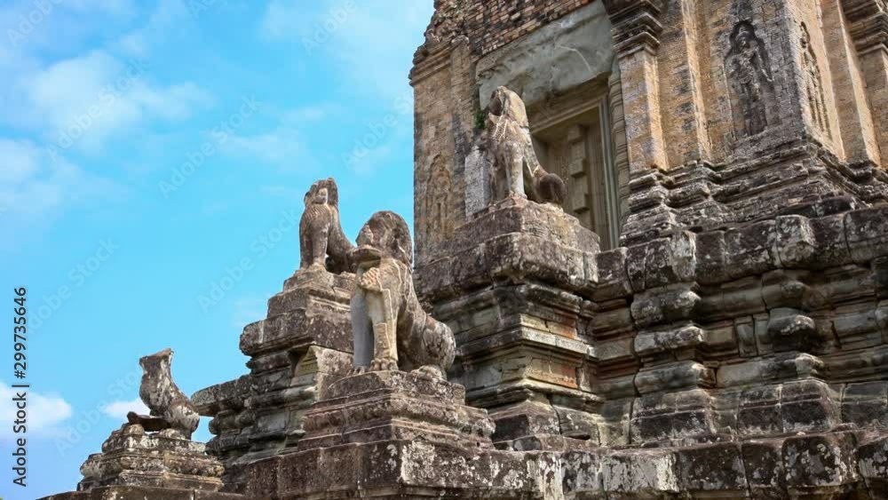 4K, Stone Lion Guardian along the stairway with blue sky and clouds at Pre Rup, The East Baray. General sight and statues of vigilant lions at the archaeological temple in Siam Reap, Cambodia.-Dan 4K, Stone Lion Guardian along the stairway with blue sky and clouds at Pre Rup, The East Baray. General sight and statues of vigilant lions at the archaeological temple in Siam Reap, Cambodia.-Dan