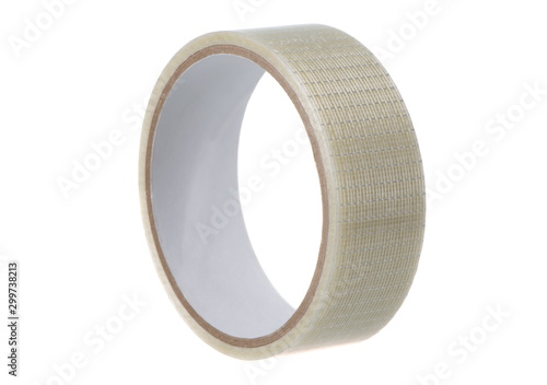 A roll of adhesive tape, close-up on a white background isolated