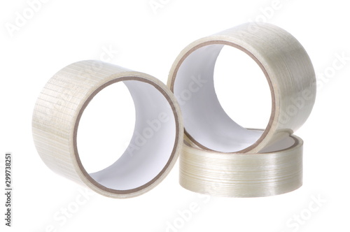 Three rolls of adhesive tape, close-up on a white background isolated