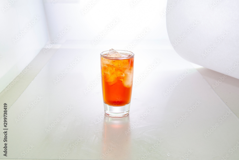 Glass of red tincture isolated on white Glass of red tincture isolated on white