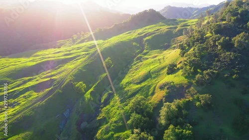 Aerial: Idyllic green landscape against sky during sunset, scenic view of mountains and trees - Napa Valley, California