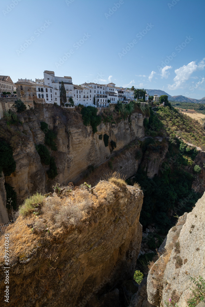 Scenic viewpoint to canyon, valley and mountains from Ronda, small ancient white town in Andalusia, Spain Scenic viewpoint to canyon, valley and mountains from Ronda, small ancient white town in Andalusia, Spain
