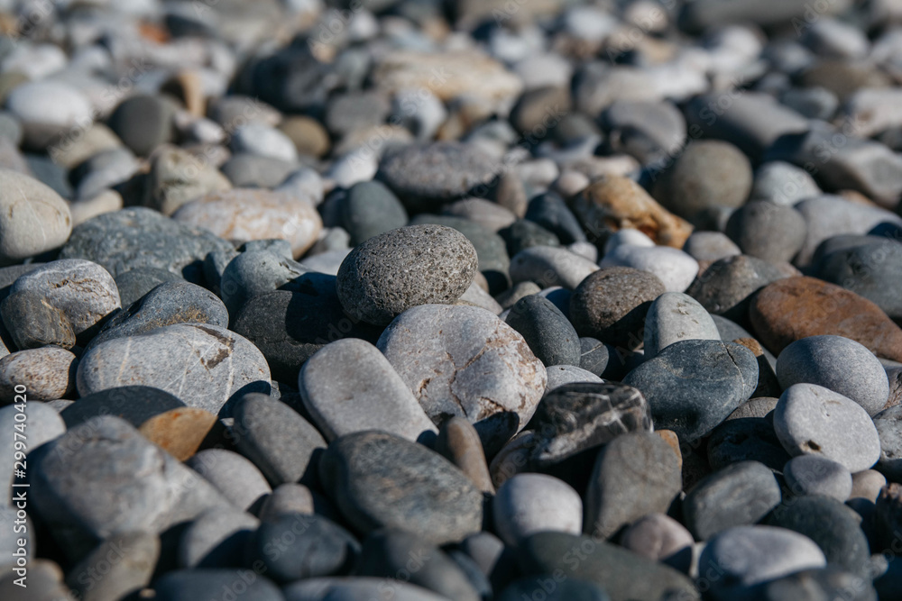 Gravel pattern of colored stones. Abstract nature pebbles background. Stone background. Sea peblles beach. Top view. Gravel pattern of colored stones. Abstract nature pebbles background. Stone background. Sea peblles beach. Top view.