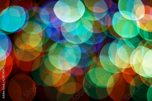 Abstract background with bright round bokeh on a dark blue background for New Year's design. Blur. Close-up