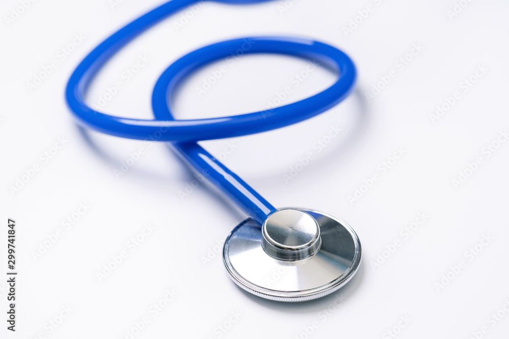 Blue stethoscope,object of doctor equipment for heartbeat trace,isolated on white background. Medical design concept,close up and studio shot. Blue stethoscope,object of doctor equipment for heartbeat trace,isolated on white background. Medical design concept,close up and studio shot.