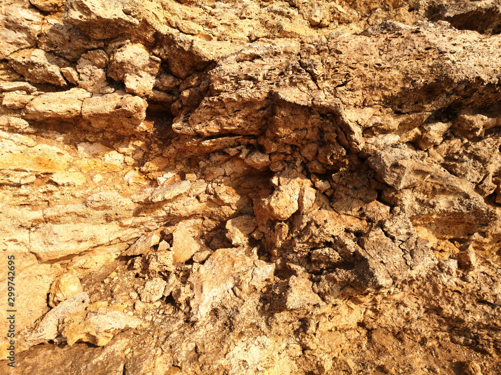 Surface of the rock with a yellow stone texture Surface of the rock with a yellow stone texture