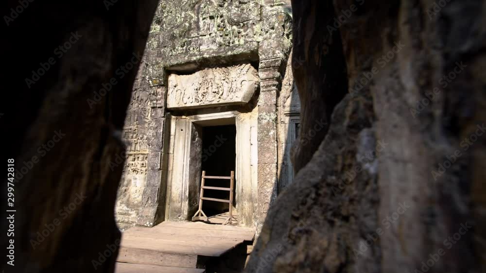 4K, Pile of rubble blocks of Ta Phrom temple. Architectural design of doors in Angkor archeological park in Siem Reap Cambodia. Built by Khmer empire. Walls as viewed from inside of worship place.-Dan 4K, Pile of rubble blocks of Ta Phrom temple. Architectural design of doors in Angkor archeological park in Siem Reap Cambodia. Built by Khmer empire. Walls as viewed from inside of worship place.-Dan
