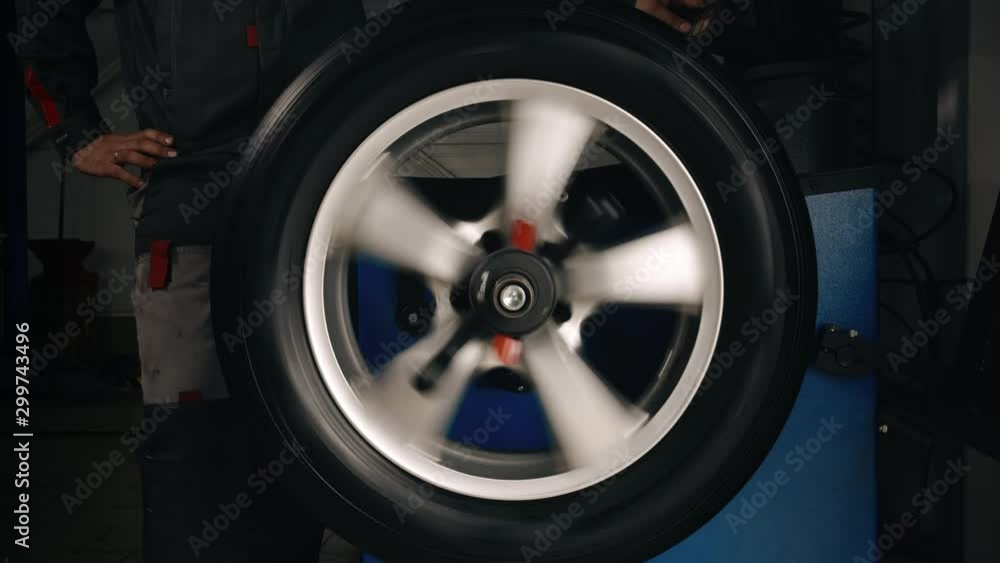 Balancing wheels in a service. Tire repair perform balancing wheels in a service Balancing wheels in a service. Tire repair perform balancing wheels in a service