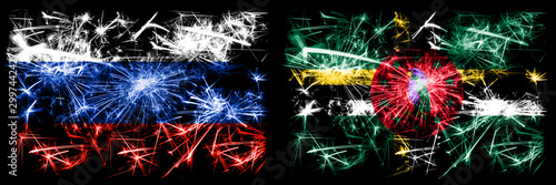 Russia, Russian vs Dominica New Year celebration sparkling fireworks flags concept background. Combination of two states flags