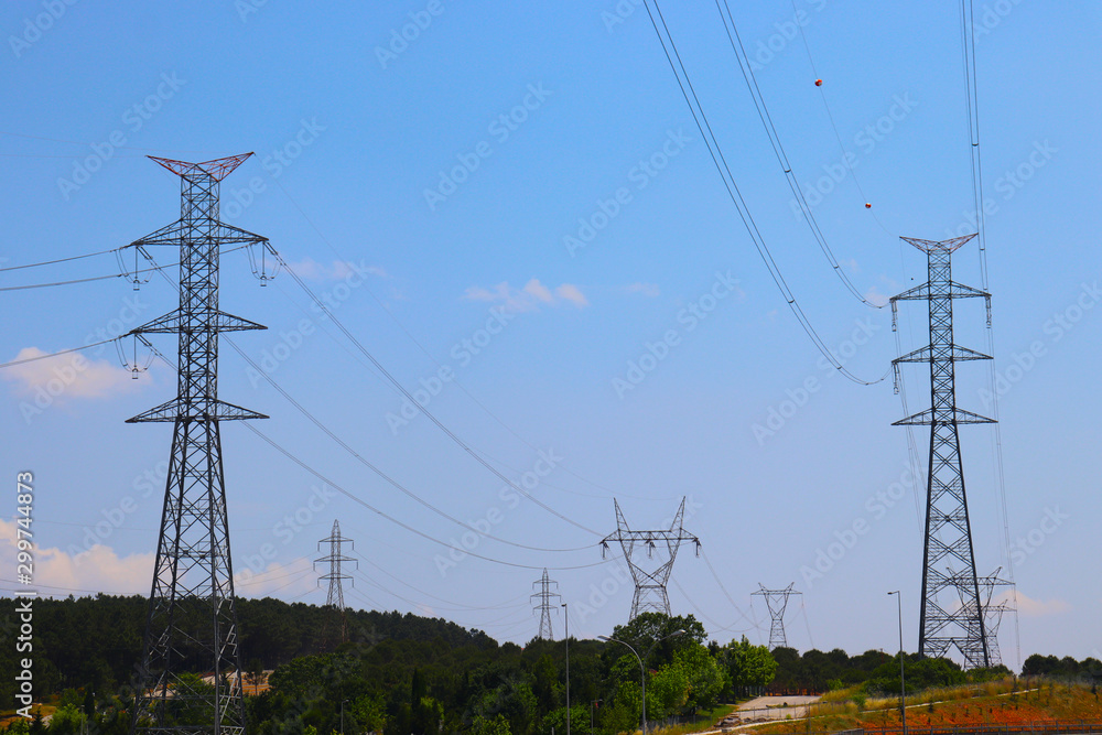 Fototapeta premium High-voltage power pylon under blue sky
