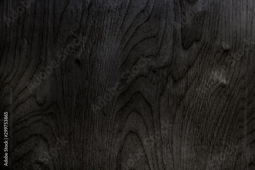 The texture is tinted in black plywood. Wooden background. Woodworking.