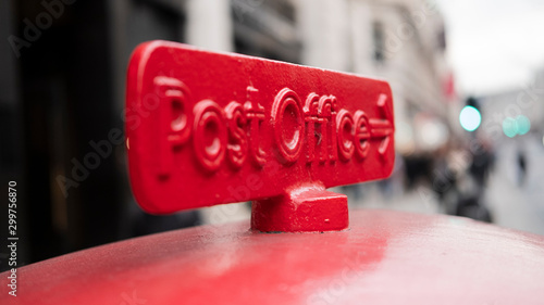 Old red cast iron sign to the Post Office in UK