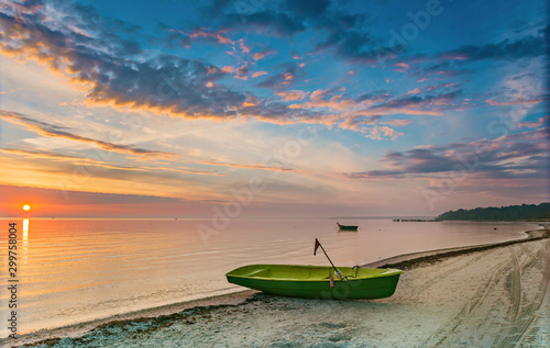 Coastal landscape with a small fishing boat that is still used for traditiona...