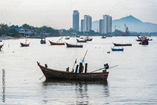 Chon Burii, Thailand - October, 05, 2019 : Fishing boats floating in the sea over cloudy sky,Chon Burii, Thailand © bubbers