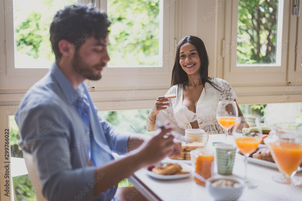 Couple in love eating breakfast in the morning Couple in love eating breakfast in the morning