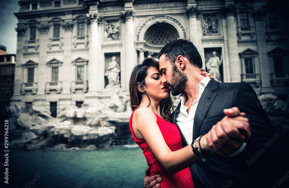 Couple spending romantic time at the trevi fountain Couple spending romantic time at the trevi fountain