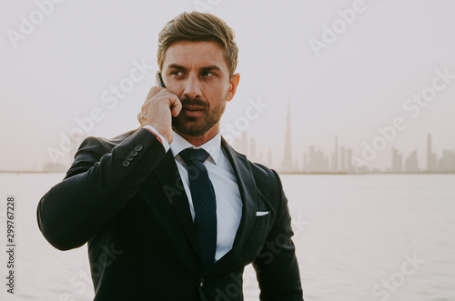 Canvas Print business man in dubai at sunset time