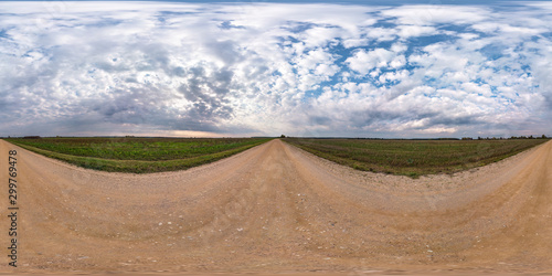 full seamless spherical hdri panorama 360 degrees angle view on gravel road among fields in autumn day with beautiful clouds in equirectangular projection, ready for VR AR virtual reality content