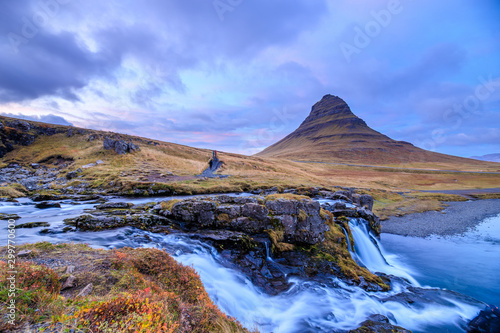 Incredible Nature landscape of Iceland. Fantastic picturesque sunset over Majestic Kirkjufell (Church mountain) and waterfalls. Kirkjufell mountain, Iceland. Famous travel locations..