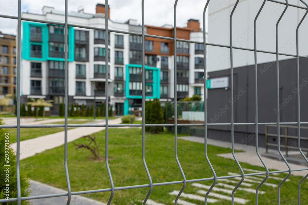 Close-up of metal mesh fencing closed territory of dwelling-house Close-up of metal mesh fencing closed territory of dwelling-house