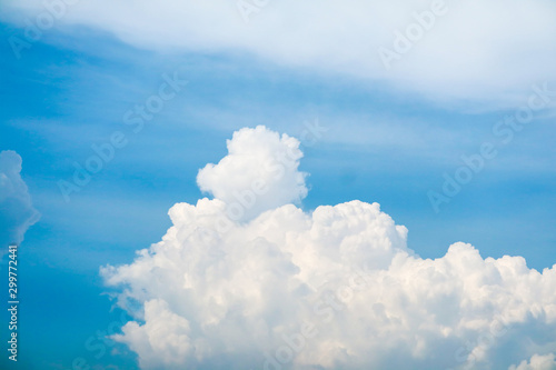 white huge heap cloud sunshine in summer blue sky soft cloud