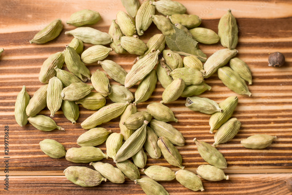 Cardamom on a wooden table. Close-up Cardamom on a wooden table. Close-up