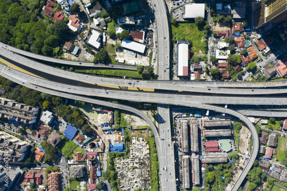 View from above, stunning aerial view of Kuala Lumpur city with a busy road intersection. Kuala Lumpur commonly known as KL, is the national capital and largest city in Malaysia.
