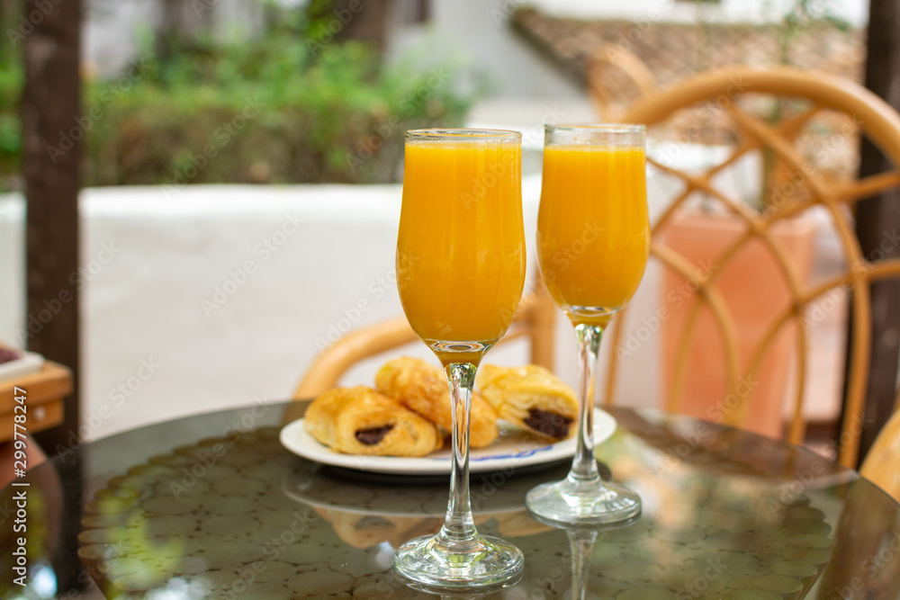 Healthy breakfast with two glasses of freshly squeezed orange juice Healthy breakfast with two glasses of freshly squeezed orange juice