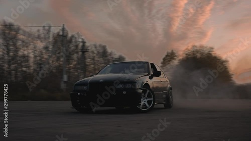 Sports car spinning in drift photo