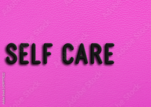 “Self care” on pink leather background