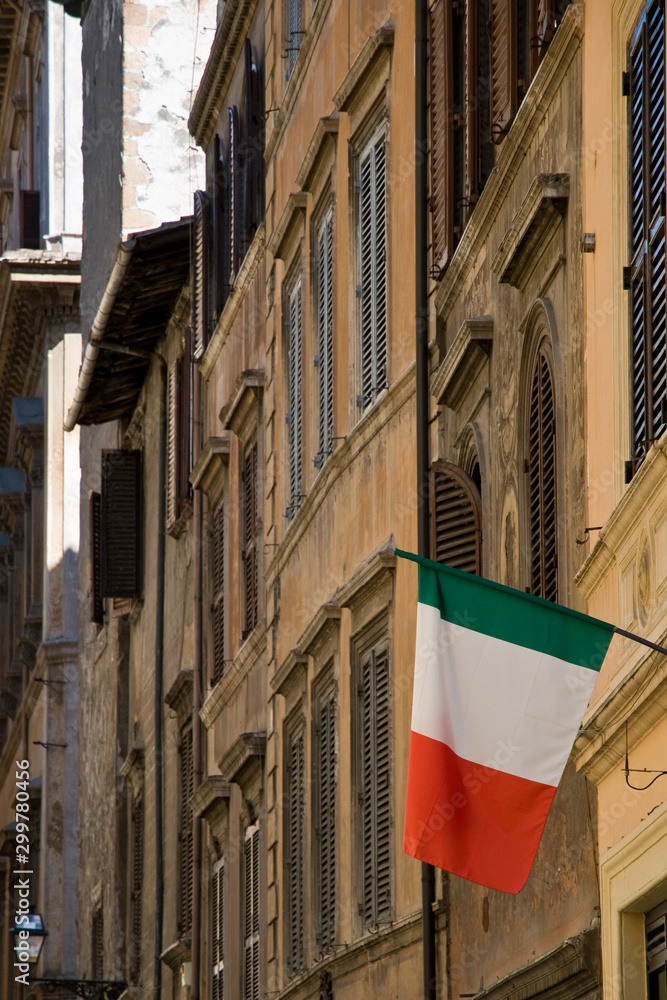 Italian flag hanging from old building