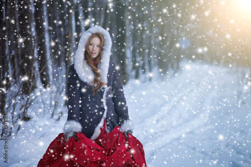 Beautiful girl in winter forest. Fairy tale.