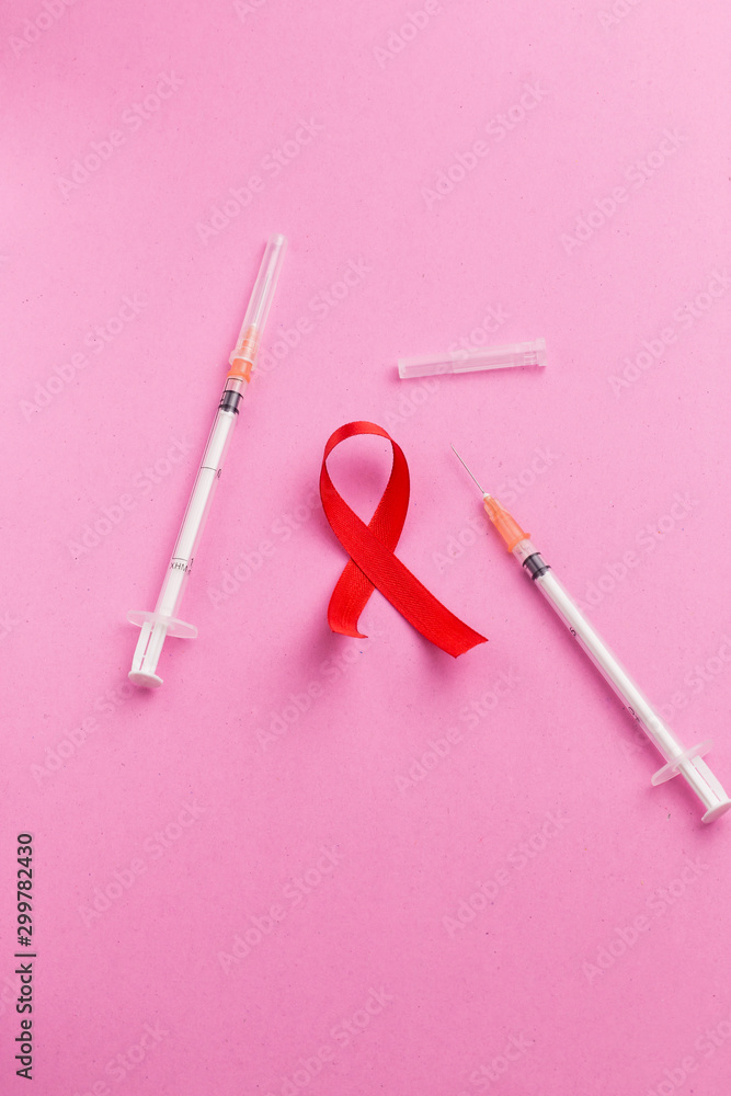 The red ribbon is an international symbol of HIV and AIDS awareness The red ribbon is an international symbol of HIV and AIDS awareness
