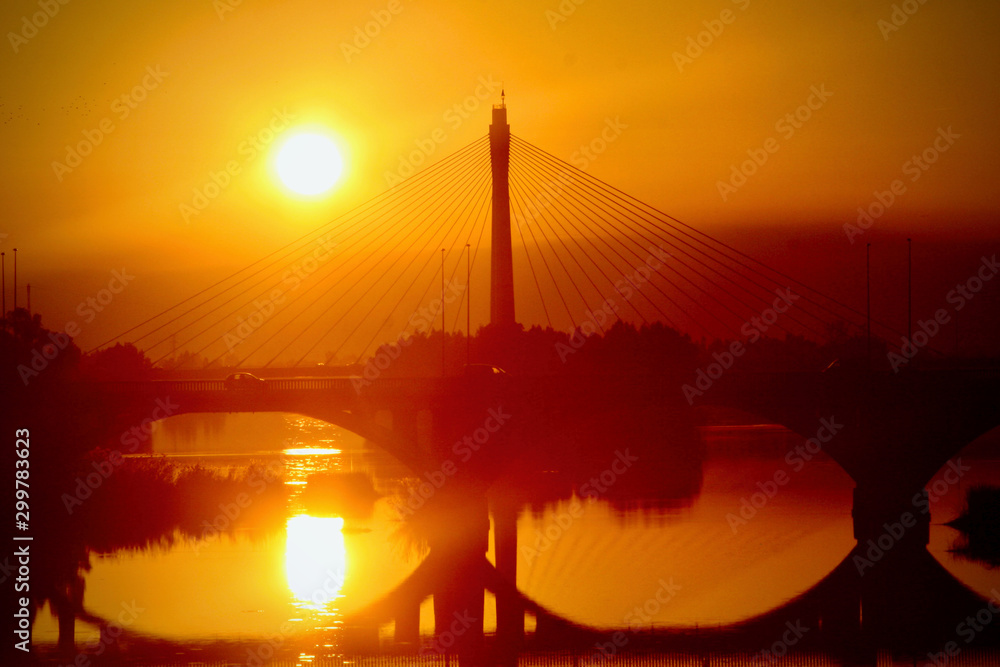Obraz premium Suspension bridge in sunset France
