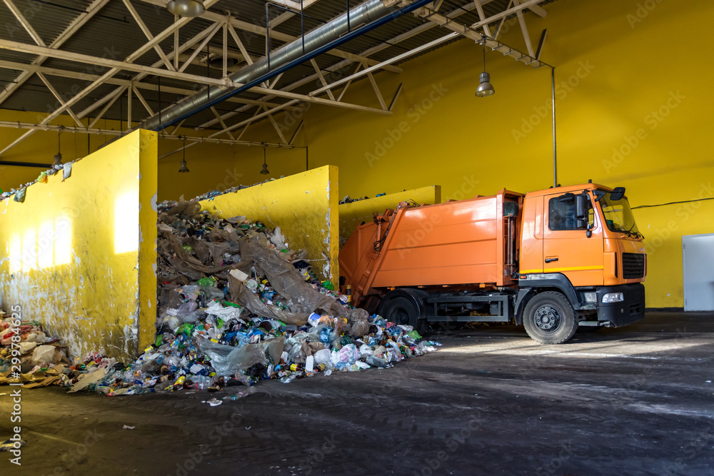 truck throws garbage at sorting modern waste recycling processing plant