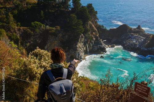 Woman watching McWay Falls in Julia Pfeiffer Burns State Park, USA